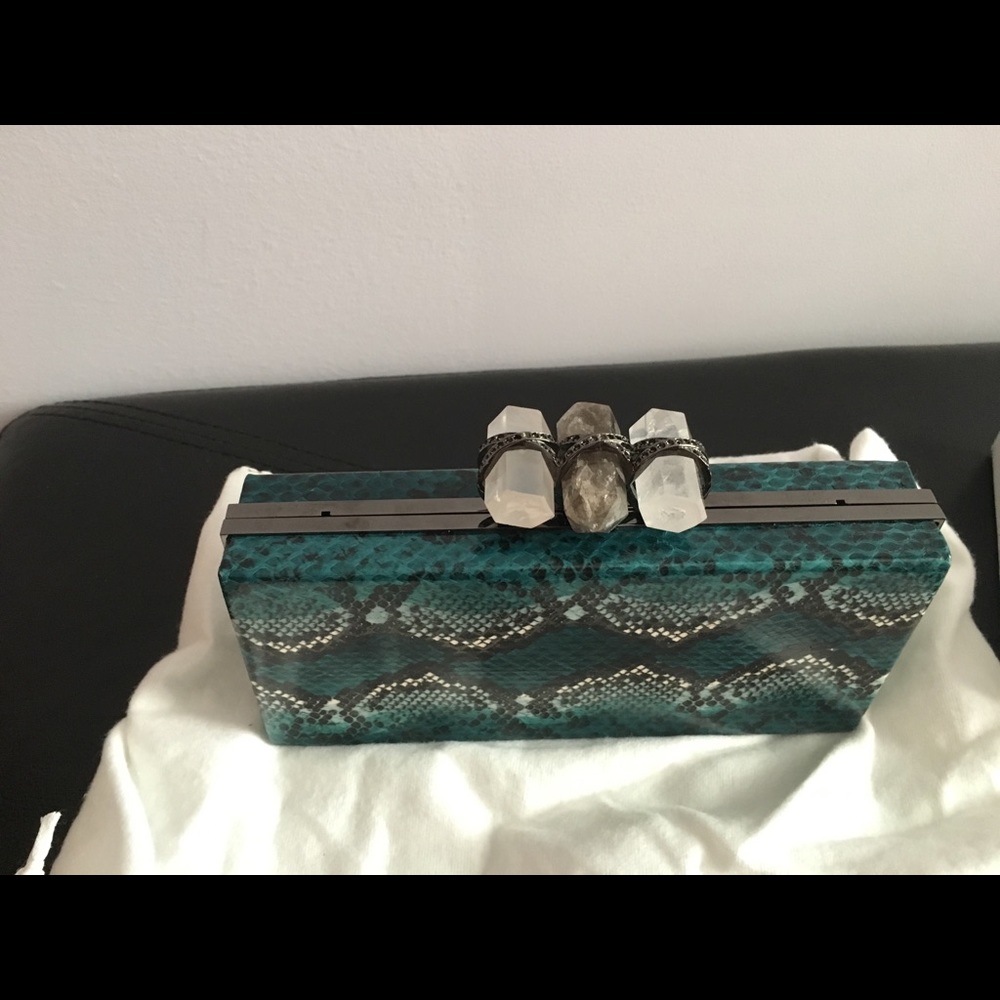 Marchesa water snake clutch with crystals.